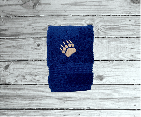 Blue washcloth, embroidered bear paw design the perfect design for the outdoor living family. This Luxury theme towel can be purchased as a set of 3 towels 1 bath towel 27" x 55", 1 hand towel 16" x 27", 1 wash cloth 13" x 13". You can personalize thebath  towel with a name and on the washcloth an initial or just designs - Borgmanns Creations