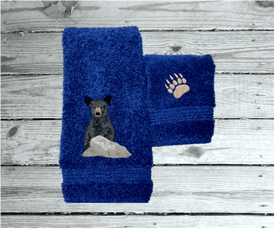 Blue hand towel washcloth, embroidered bear design the perfect design for the outdoor living family. This Luxury theme towels can be purchased in a set of 3 towels 1 bath towel 27" x 55", 1 hand towel 16" x 27", 1 wash cloth 13" x 13". You can personalize thebath towel with a name and on the washcloth an initial or just designs - Borgmanns Creations
