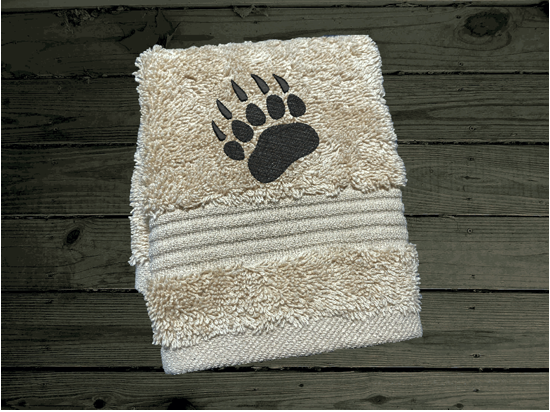 Beige  washcloth, embroidered bear design the perfect design for the outdoor living family. This Luxury theme towel set of 3 towels 1 bath towel 27" x 50", 1 hand towel 16" x 27", 1 wash cloth 13" x 13". You can personalize the towel set with a name and name on the washcloth or just designs. Borgmanns Creations 