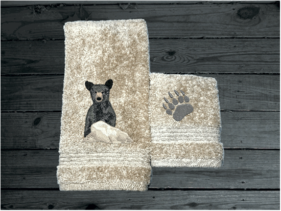 Beige hand towel and washcloth , embroidered bear design the perfect design for the outdoor living family. This Luxury theme towel set of 3 towels 1 bath towel 27" x 50", 1 hand towel 16" x 27", 1 wash cloth 13" x 13". You can personalize the towel set with a name and name on the washcloth or just designs. Borgmanns Creations 