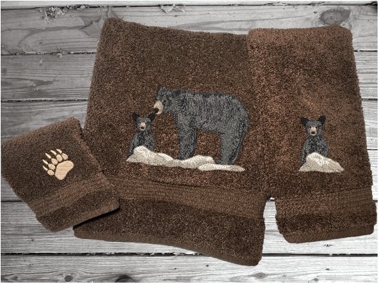 Brown bath towel set or individual towels, embroidered bear design the perfect design for the outdoor living family. This Luxury theme towel set of 3 towels 1 bath towel 27" x 50", 1 hand towel 16" x 27", 1 wash cloth 13" x 13". You can personalize the towel set with a name and name on the washcloth or just designs. Borgmanns Creations 2