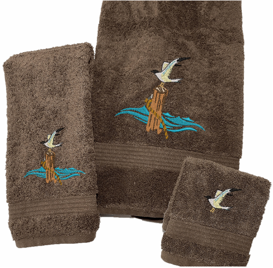 Brown High Quality Luxury Turkish Towels durable soft and absorbent, finished edges with a decorative band. Set has 1 bath towel 27" x 50", 1 hand towel 16' x 27", 1 washcloth 13" x 13". Embroidered with a custom design. You can personalize the towel set with a name and an initial on the washcloth or just the designs. These luxury towels will make a wonderful wedding gift, housewarming gift, or for your own bathroom decor. Borgmanns Creations