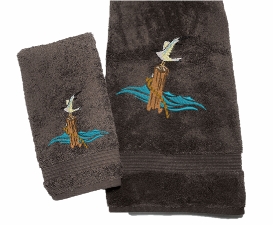 Brown High Quality Luxury Turkish Bath Towel and washcloth, durable soft and absorbent, finished edges with a decorative band. Set has 1 bath towel 27" x 50", 1 hand towel 16' x 27", 1 washcloth 13" x 13". Embroidered with a custom design. You can personalize the towel set with a name and an initial on the washcloth or just the designs. These luxury towels will make a wonderful wedding gift, housewarming gift, or for your own bathroom decor. Borgmanns Creation