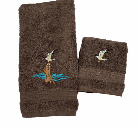 Brown High Quality Luxury Turkish Hand Towel and washcloth, durable soft and absorbent, finished edges with a decorative band. Set has 1 bath towel 27" x 50", 1 hand towel 16' x 27", 1 washcloth 13" x 13". Embroidered with a custom design. You can personalize the towel set with a name and an initial on the washcloth or just the designs. These luxury towels will make a wonderful wedding gift, housewarming gift, or for your own bathroom decor. Borgmanns Creation