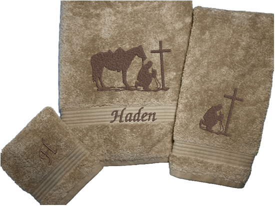 Beige bath towel set or individual towels, embroidered cowboy praying design, the perfect design for that farmhouse decor. This towel set has 3 towels 1 bath towel 27" x 55", 1 hand towel 16" x 27", 1 wash cloth 13" x 13". You can personalize the towel set with a name and an initial on the wash cloth - Borgmanns Creations