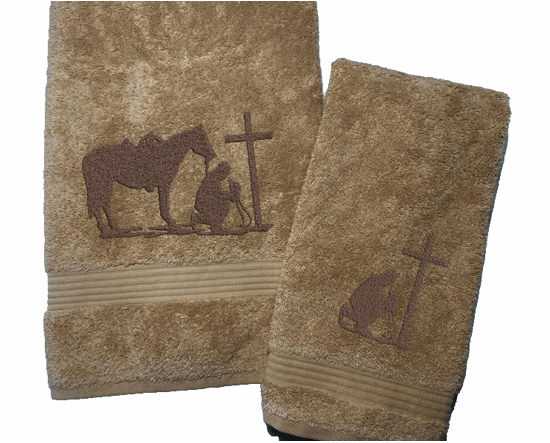 Beige bath towel and hand towel, embroidered cowboy praying design, the perfect design for that farmhouse decor. This towel set has 3 towels 1 bath towel 27" x 55", 1 hand towel 16" x 27", 1 wash cloth 13" x 13". You can personalize the towel set with a name and an initial on the wash cloth - Borgmanns Creations