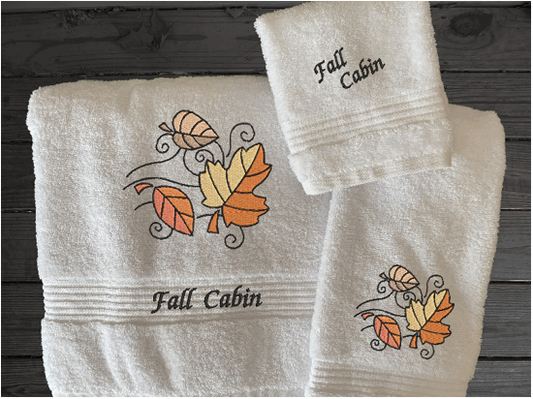 White bath towel set or individual towels, embroidered Fall leaves is the perfect design for the country living family, that likes the outdoor life, for that farmhouse decor. This Luxury towel set of 3 towels 1 bath towel 27" x 50", 1 hand towel 15" x 27", 1 wash cloth 13" x 13". You can personalize the towel set with a name on the bath towel and an initial on the wash cloth or just the designs. Borgmanns Creations