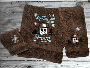 Brown bath towel set,or individual towels, embroidered design of a barn at Christman time is perfect for the country living family, for that farmhouse decor. This Luxury soft and absorbent western theme towel set of 3 towels 1 bath towel 27" x50", 1 hand towel 16" x27", 1 wash cloth 13" x 13". - Borgmanns Creations - 1