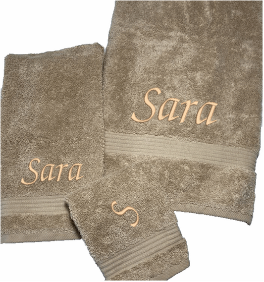Personalized luxury beige bath towel, set  has 3 towels 1 bath towel 27" x 50", 1 hand towel 15: x 27", 1 wash cloth 13" x 13. You can personalize the towel set with embroidered  name for that special wedding gift or housewarming gift. Borgmanns Creations
