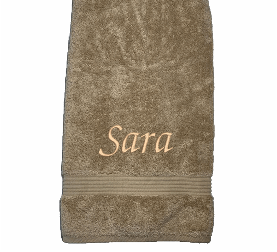 Personalized luxury beige bath towel, set has 3 towels 1 bath towel 27" x 50", 1 hand towel 15: x 27", 1 wash cloth 13" x 13. You can personalize the towel set with embroidered name for that special wedding gift or housewarming gift. Borgmanns Creations