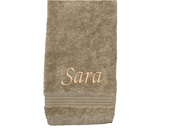 Personalized luxury beige hand towel, set has 3 towels 1 bath towel 27" x 50", 1 hand towel 15: x 27", 1 wash cloth 13" x 13. You can personalize the towel set with embroidered name for that special wedding gift or housewarming gift. Borgmanns Creations