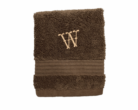 High Quality Luxury Turkish Brown washcloth, durable soft and absorbent, finished edges with a decorative band. Set has 1 bath towel 27 x50", 1 hand towel 15" x 27", 1 washcloth 13" x 13. Embroidered with a custom name,  an initial on the washcloth. These luxury towels will make a wonderful wedding gift, housewarming gift, or for your own bathroom decor. Borgmanns Creations
