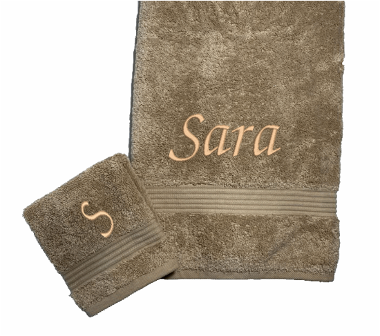Personalized luxury beige bath towel and washcloth, set has 3 towels 1 bath towel 27" x 50", 1 hand towel 15: x 27", 1 wash cloth 13" x 13. You can personalize the towel set with embroidered name for that special wedding gift or housewarming gift. Borgmanns Creations