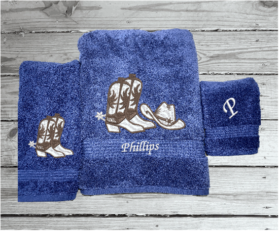 Blue bath towel set or individual towels, cowboy hat and boots is the perfect design for that farmhouse decor. This Luxury Turkish towel set has 3 towels 1 bath towel 27"x55", 1 hand towel 15"x28", 1 wash cloth 13'x13". Personalize the towel set with a name and an initial on the wash cloth or just the designs. Borgmanns Creations -1