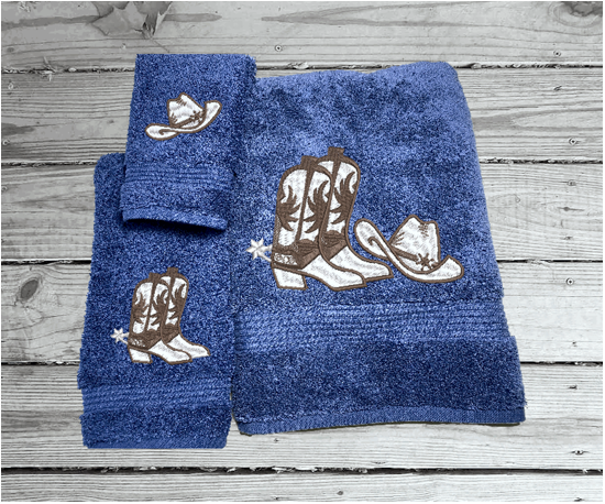 Blue bath towel set or individual towels, cowboy hat and boots is the perfect design for that farmhouse decor. This Luxury Turkish towel set has 3 towels 1 bath towel 27"x55", 1 hand towel 15"x28", 1 wash cloth 13'x13". Personalize the towel set with a name and an initial on the wash cloth or just the designs. Borgmanns Creations -2