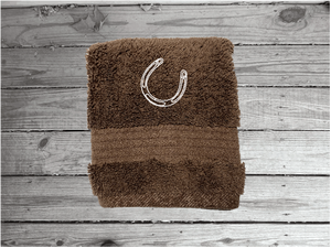 Brown  washcloth high quality luxury Turkish Towels durable soft and absorbent, finished edges with a decorative band. Set has 1 bath towel, 1 hand towel, 1 washcloth. Embroidered with a custom design of a bronc rider. You can personalize the towel set with a name and an initial on the washcloth or just the designs. These luxury towels will make a wonderful hostess towel, wedding gift, housewarming gift, or for your own bathroom decor. Borgmanns Creations - 5
