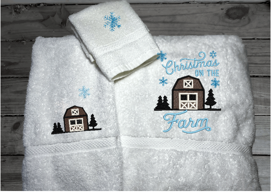 White bath towel set, or individual towels, embroidered design of a barn at Christmas time is perfect for the country living family, for that farmhouse decor. This Luxury soft and absorbent Christmas theme towel set of 3 towels 1 bath towel 27" x50", 1 hand towel 16" x 27", 1 wash cloth 13" x 13". Borgmanns Creations 1