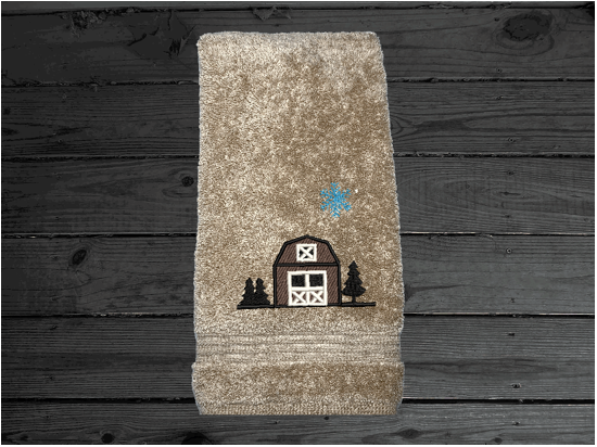 Beige hand towel, embroidered design of a barn at Christmas time, is perfect for for that farmhouse decor. This Luxury soft and absorbent bathroom towel is in a set of 3 towels 1 bath towel 27" x 55", 1 hand towel 16" x27", 1 wash cloth 13" x 13". Housewarming, best friend, or family gift. Borgmanns Creations