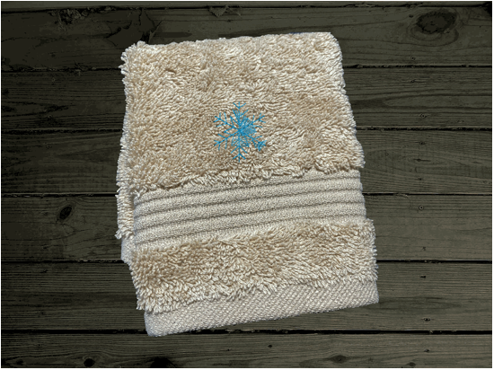 Beige washcloth , embroidered design of a barn at Christmas time, is perfect for for that farmhouse decor. This Luxury soft and absorbent bathroom towel is in a set of 3 towels 1 bath towel 27" x 55", 1 hand towel 16" x27", 1 wash cloth 13" x 13". Housewarming, best friend, or family gift. Borgmanns Creations