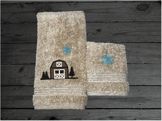 Beige hand towel and washcloth, embroidered design of a barn at Christmas time, is perfect for for that farmhouse decor. This Luxury soft and absorbent bathroom towel is in a set of 3 towels 1 bath towel 27" x 55", 1 hand towel 16" x27", 1 wash cloth 13" x 13". Housewarming, best friend, or family gift. Borgmanns Creations