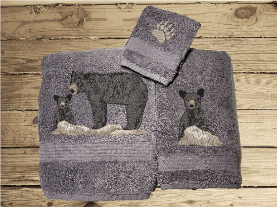 Gray bath towel set or individual towels, embroidered bear design the perfect design for the outdoor living family. This Luxury theme towel set of 3 towels 1 bath towel 27" x 55", 1 hand towel 16" x 27", 1 wash cloth 13" x 13". You can personalize the towel set with a name and name on the washcloth or just designs. Borgmanns Creations 2