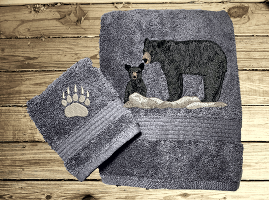Gray bath towel and washcloth , embroidered bear design the perfect design for the outdoor living family. This Luxury theme towel set of 3 towels 1 bath towel 27" x 50", 1 hand towel 16" x 27", 1 wash cloth 13" x 13". You can personalize the towel set with a name and name on the washcloth or just designs. Borgmanns Creations