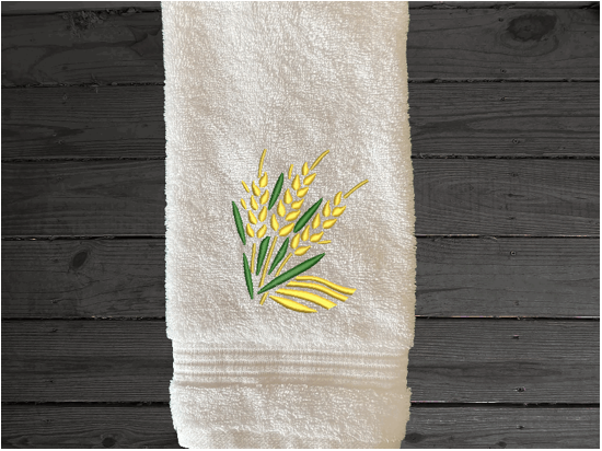White hand towel, wheat design is the perfect design for the country living family, that likes the outdoor life, for that farmhouse decor. This Luxury farmhouse theme towel set has 3 towels 1 bath towel 17' x 50", 1 hand towel 16" x 27", 1 wash cloth 13" x 13". You can personalize the towel set with a name and an initial on the wash cloth or just the designs. Borgmanns Creations