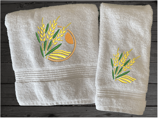White bath towel and hand towel, wheat design is the perfect design for the country living family, that likes the outdoor life, for that farmhouse decor. This Luxury farmhouse theme towel set has 3 towels 1 bath towel 17' x 50", 1 hand towel 16" x 27", 1 wash cloth 13" x 13". You can personalize the towel set with a name and an initial on the wash cloth or just the designs. Borgmanns Creations