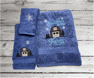 Blue bath towel set, or individual towels, embroidered design of a barn at Christmas time is perfect for the country living family, for that farmhouse decor. This Luxury soft and absorbent Christmas theme towel set of 3 towels 1 bath towel 27" x50", 1 hand towel 16" x 27", 1 wash cloth 13" x 13".  Borgmanns Creations 1