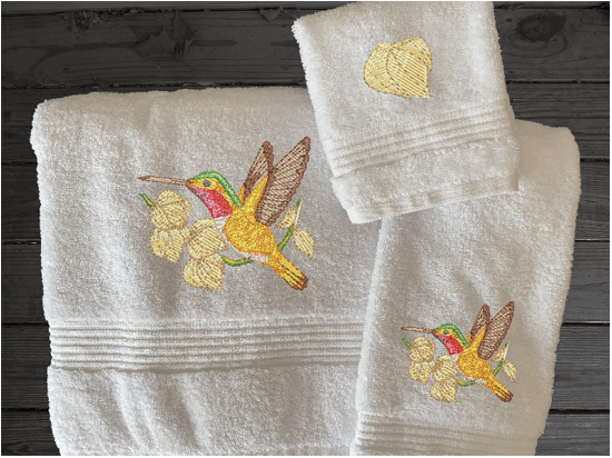 Luxury bath towel set or individual towels, embroidered hummingbird is the perfect design for the Spring/Summer look. This Luxury towel set of 3 towels 1 bath towel 27" x 50", 1 hand towel 16" x 27", 1 wash cloth 13" x 13". You can personalize the bath towel with a name. Borgmanns Creations