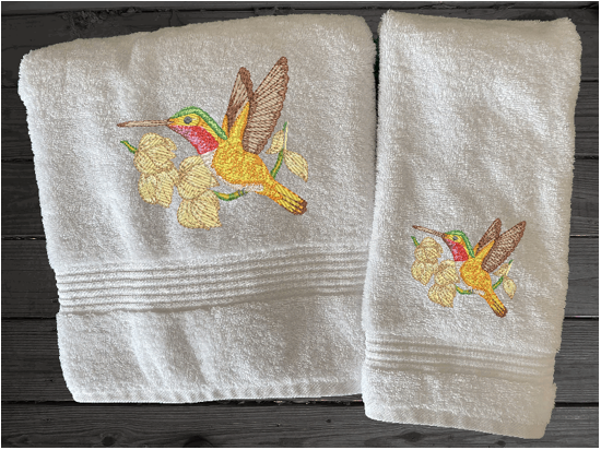 Luxury bath towel and hand towels, embroidered hummingbird is the perfect design for the Spring/Summer look. This Luxury towel set of 3 towels 1 bath towel 27" x 50", 1 hand towel 16" x 27", 1 wash cloth 13" x 13". You can personalize the bath towel with a name. Borgmanns Creations