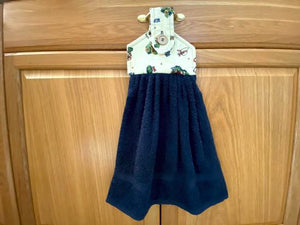 Blue terry towel over all size of 21 inches, the top has batting between layers of garden bees and flowers cotton material and a button for fastening on oven handle, drawer handle, icebox, shower bar or bathroom hanger. A wonderful way to have a towel handy at all times.  This item is ready to ship. - Borgmanns Creations - 1