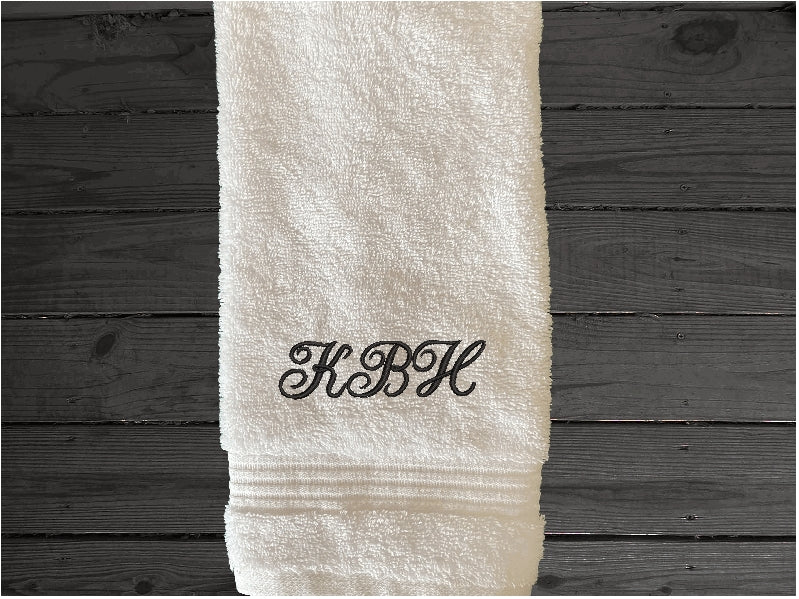 White hand towel set personalized bath towels with embroidered monogram initials. Soft absorbent bath towels, hand towels and washcloths, bath towel - 27" x 50", hand towel - 16" x 27", wash cloth - 13" x 13, "a gift for anyone in the family or a gift for a friend. Monogram towels for that special wedding gift. This font is Anniversary- Borgmanns Creations