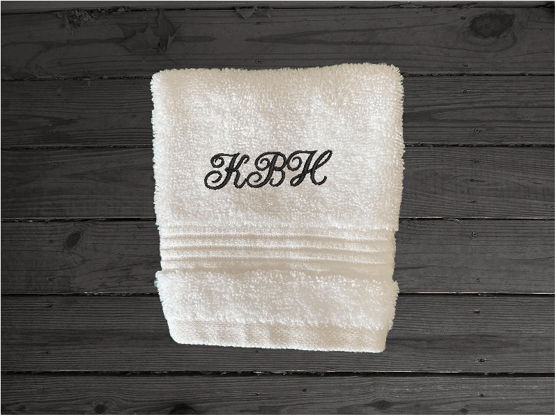 White washcloth, personalized bath towels with embroidered monogram initials. Soft absorbent bath towels, hand towels and washcloths, bath towel - 27" x 50", hand towel - 16" x 27", wash cloth - 13" x 13, "a gift for anyone in the family or a gift for a friend. Monogram towels for that special wedding gift. This font is Anniversary- Borgmanns Creations