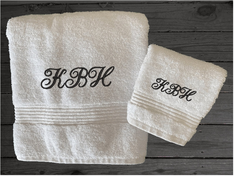 White bath towel and washcloth, personalized bath towels with embroidered monogram initials. Soft absorbent bath towels, hand towels and washcloths, bath towel - 27" x 50", hand towel - 16" x 27", wash cloth - 13" x 13, "a gift for anyone in the family or a gift for a friend. Monogram towels for that special wedding gift. This font is Anniversary- Borgmanns Creations