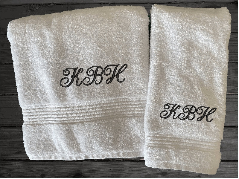 White bath towel and hand towel personalized with embroidered monogram initials. Soft absorbent bath towel, bath towel - 27" x 55", hand towel 16" x 27"  a gift for anyone in the family or a gift for a friend. Monogram towels for that special wedding gift. This font is Anniversary- Borgmanns Creations