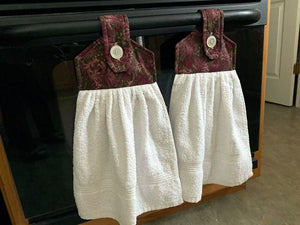 White terry towel over all size of 21 inches, the top has batting between layers of marroon floral cotton material and a button for fastening on oven handle, drawer handle, icebox, shower bar or bathroom hanger. A wonderful way to  have a towel handy at all times.  This item is ready to ship. - Borgmanns Creations -9