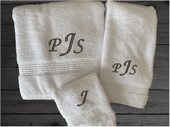 White personalized luxury bath towels with embroidered monogram initials. Luxury towels 1 bath towel 27" x 50", 1 hand towel 16" x 27", 1 washcloth 13" x 13", soft and absorbent with decorative band, bathroom decor. Soft absorbent bath towels, a gift for anyone in the family or a gift for a friend. Monogram name for that special wedding gift. Borgmanns Creations