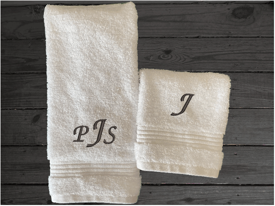 White personalized luxury hand toweland washcloth, with embroidered monogram initials. Luxury towels 1 bath towel 27" x 50", 1 hand towel 16" x 27", 1 washcloth 13" x 13", soft and absorbent with decorative band, bathroom decor. Soft absorbent bath towels, a gift for anyone in the family or a gift for a friend. Monogram name for that special wedding gift. Borgmanns Creations