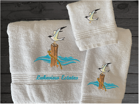 White High Quality Luxury Turkish Towels durable soft and absorbent, finished edges with a decorative band. Set has 1 bath towel 27" x 50", 1 hand towel 16" x 27", 1 washcloth 13" x 13". Embroidered with a custom sea gull design. You can personalize the towel set with a name and an initial on the washcloth or just the designs. These luxury towels will make a wonderful wedding gift, housewarming gift, or for your own bathroom decor. Borgmanns Creations