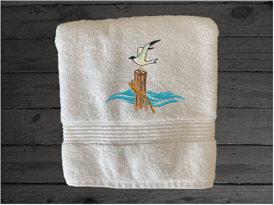 White High Quality Luxury Turkish bath towel, durable soft and absorbent, finished edges with a decorative band. Set has 1 bath towel 27" x 50", 1 hand towel 16" x 27", 1 washcloth 13" x 13". Embroidered with a custom sea gull design. You can personalize the towel set with a name and an initial on the washcloth or just the designs. These luxury towels will make a wonderful wedding gift, housewarming gift, or for your own bathroom decor. Borgmanns Creations
