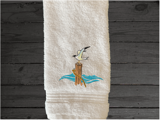 White High Quality Luxury Turkish hand towel, durable soft and absorbent, finished edges with a decorative band. Set has 1 bath towel 27" x 50", 1 hand towel 16" x 27", 1 washcloth 13" x 13". Embroidered with a custom sea gull design. You can personalize the towel set with a name and an initial on the washcloth or just the designs. These luxury towels will make a wonderful wedding gift, housewarming gift, or for your own bathroom decor. Borgmanns Creations