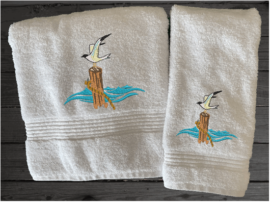 White High Quality Luxury Turkish bath towel and hand towel, durable soft and absorbent, finished edges with a decorative band. Set has 1 bath towel 27" x 50", 1 hand towel 16" x 27", 1 washcloth 13" x 13". Embroidered with a custom sea gull design. You can personalize the towel set with a name and an initial on the washcloth or just the designs. These luxury towels will make a wonderful wedding gift, housewarming gift, or for your own bathroom decor. Borgmanns Creations