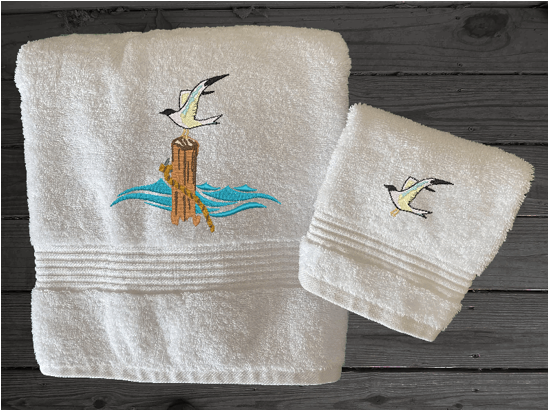 White High Quality Luxury Turkish bath towel and washcloth, durable soft and absorbent, finished edges with a decorative band. Set has 1 bath towel 27" x 50", 1 hand towel 16" x 27", 1 washcloth 13" x 13". Embroidered with a custom sea gull design. You can personalize the towel set with a name and an initial on the washcloth or just the designs. These luxury towels will make a wonderful wedding gift, housewarming gift, or for your own bathroom decor. Borgmanns Creations