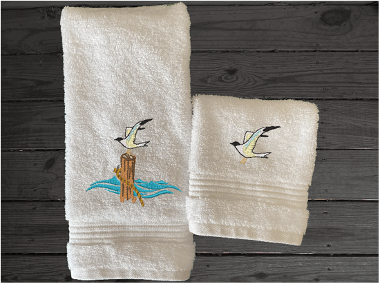 White High Quality Luxury Turkish hand towel and washcloth, durable soft and absorbent, finished edges with a decorative band. Set has 1 bath towel 27" x 50", 1 hand towel 16" x 27", 1 washcloth 13" x 13". Embroidered with a custom sea gull design. You can personalize the towel set with a name and an initial on the washcloth or just the designs. These luxury towels will make a wonderful wedding gift, housewarming gift, or for your own bathroom decor. Borgmanns Creations