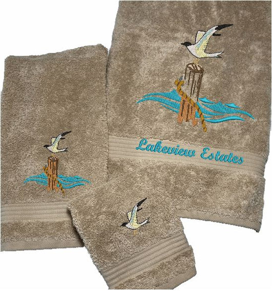 Beige High Quality Luxury Turkish Towels durable soft and absorbent, finished edges with a decorative band. Set has 1 bath towel 27" x 50", 1 hand towel 16" x 27", 1 washcloth 13" x 13". Embroidered with a custom design. You can personalize the towel set with a name and an initial on the washcloth or just the designs. These luxury towels will make a wonderful wedding gift, housewarming gift, or for your own bathroom decor. Borgmanns Creations