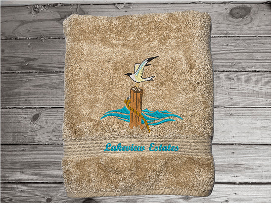 High Quality Luxury Turkish beige bath towel, durable soft and absorbent, finished edges with a decorative band. Set has 1 bath towel 27" x 50", 1 hand towel 16" x 27", 1 washcloth 13" x 13". Embroidered with a custom sea gull on a post design. You can personalize the towel set with a name and an initial on the washcloth or just the designs. These luxury towels will make a wonderful wedding gift, housewarming gift, or for your own bathroom decor. Borgmanns Cretions