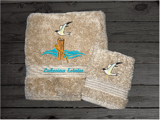 High Quality Luxury Turkish beige bath towel and washcloth, durable soft and absorbent, finished edges with a decorative band. Set has 1 bath towel 27" x 50", 1 hand towel 16" x 27", 1 washcloth 13" x 13". Embroidered with a custom sea gull on a post design. You can personalize the towel set with a name and an initial on the washcloth or just the designs. These luxury towels will make a wonderful wedding gift, housewarming gift, or for your own bathroom decor. Borgmanns Cretions