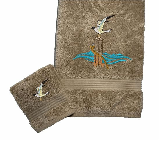 Beige High Quality Luxury Turkish Bath Towel and washcloth, durable soft and absorbent, finished edges with a decorative band. Set has 1 bath towel 27" x 50", 1 hand towel 16" x 27", 1 washcloth 13" x 13". Embroidered with a custom design. You can personalize the towel set with a name and an initial on the washcloth or just the designs. These luxury towels will make a wonderful wedding gift, housewarming gift, or for your own bathroom decor. Borgmanns Creations