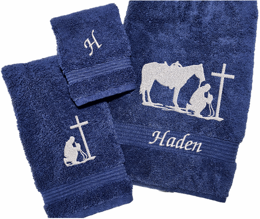 Blue bath towel set or individual towels, embroidered cowboy praying design, the perfect design for that farmhouse decor. This towel set has 3 towels 1 bath towel 27" x 55", 1 hand towel 16" x 27", 1 wash cloth 13" x 13". You can personalize the towel set with a name and an initial, on the wash cloth - Borgmanns Creations 